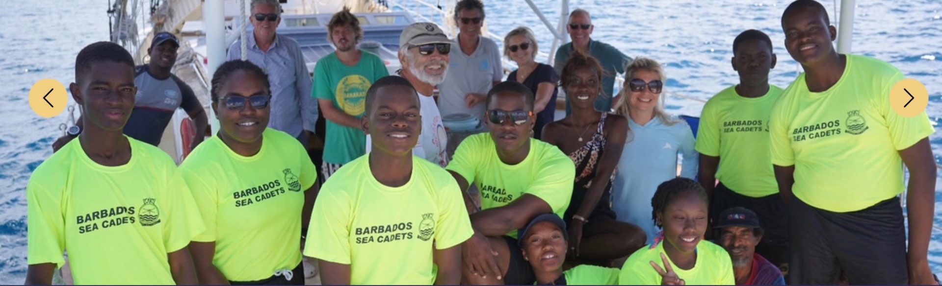 Schooner RUTH youth trainees gathered together in yellow programme shirts